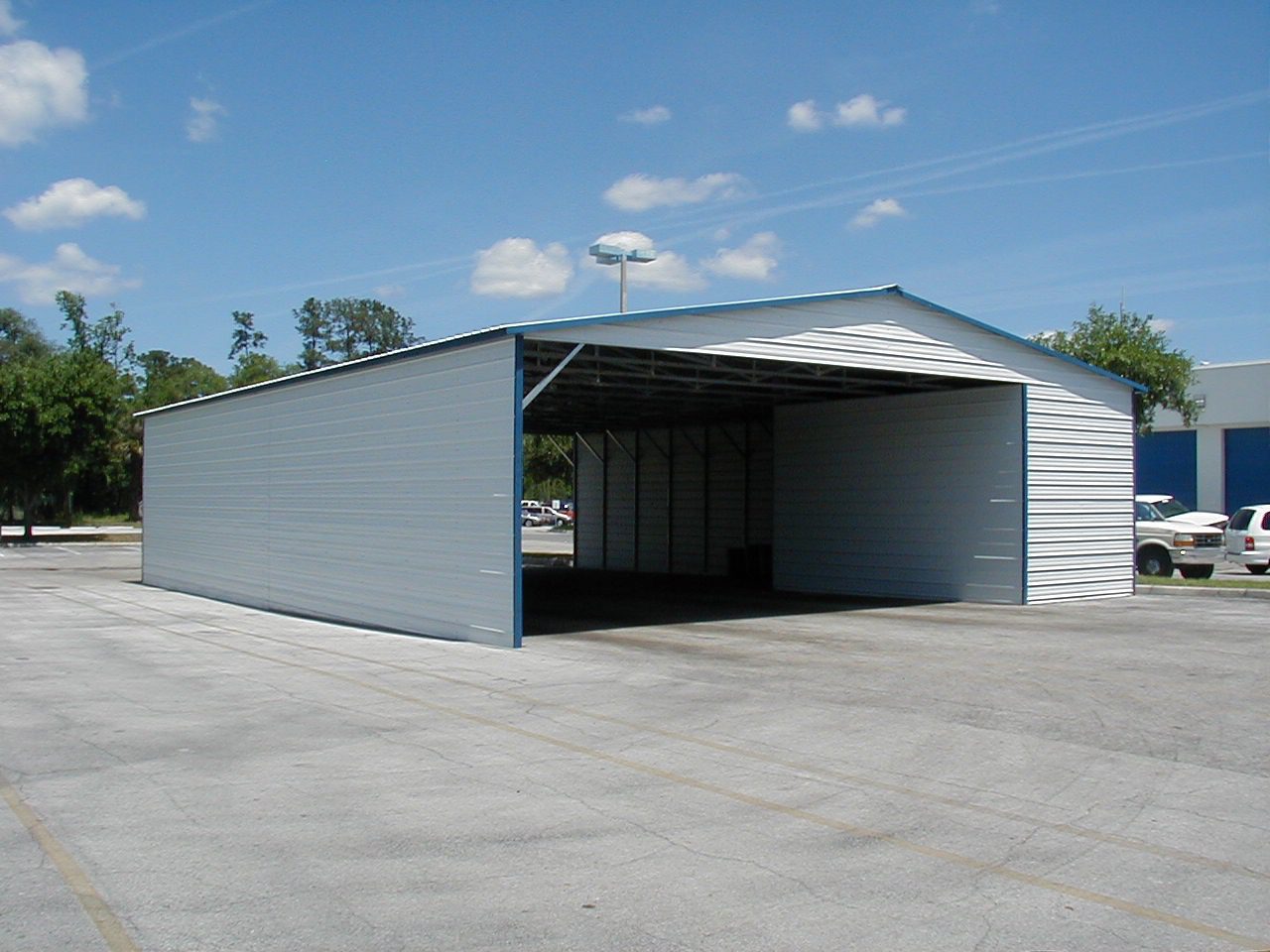 A white garage with two doors and a sky background