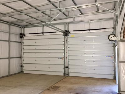A garage with two doors and no windows.