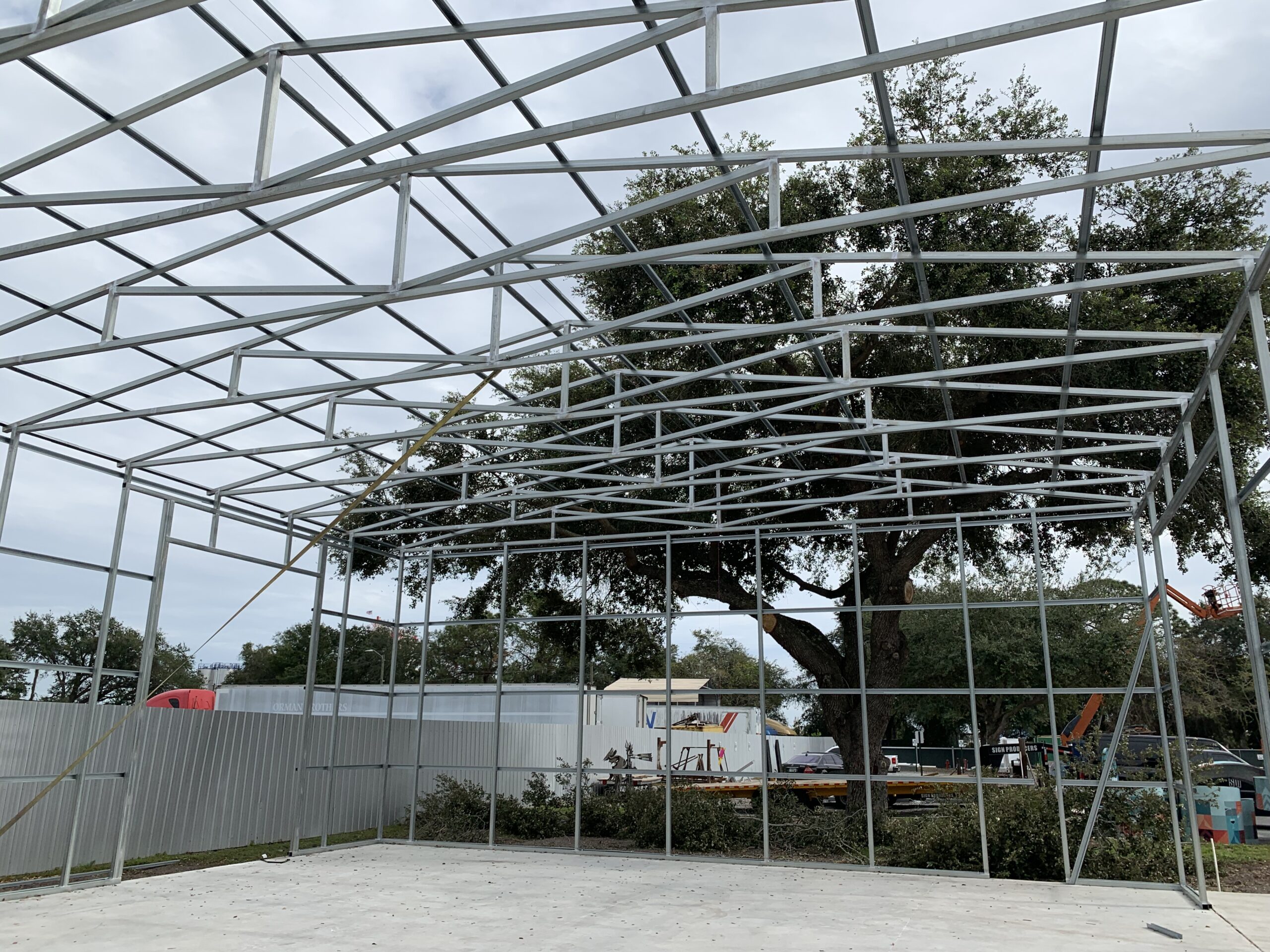 A metal structure with trees in the background.