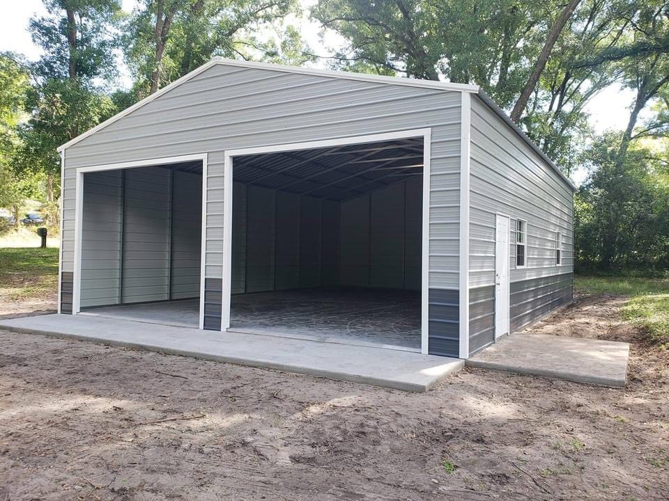 A large garage with two sides and one side open.