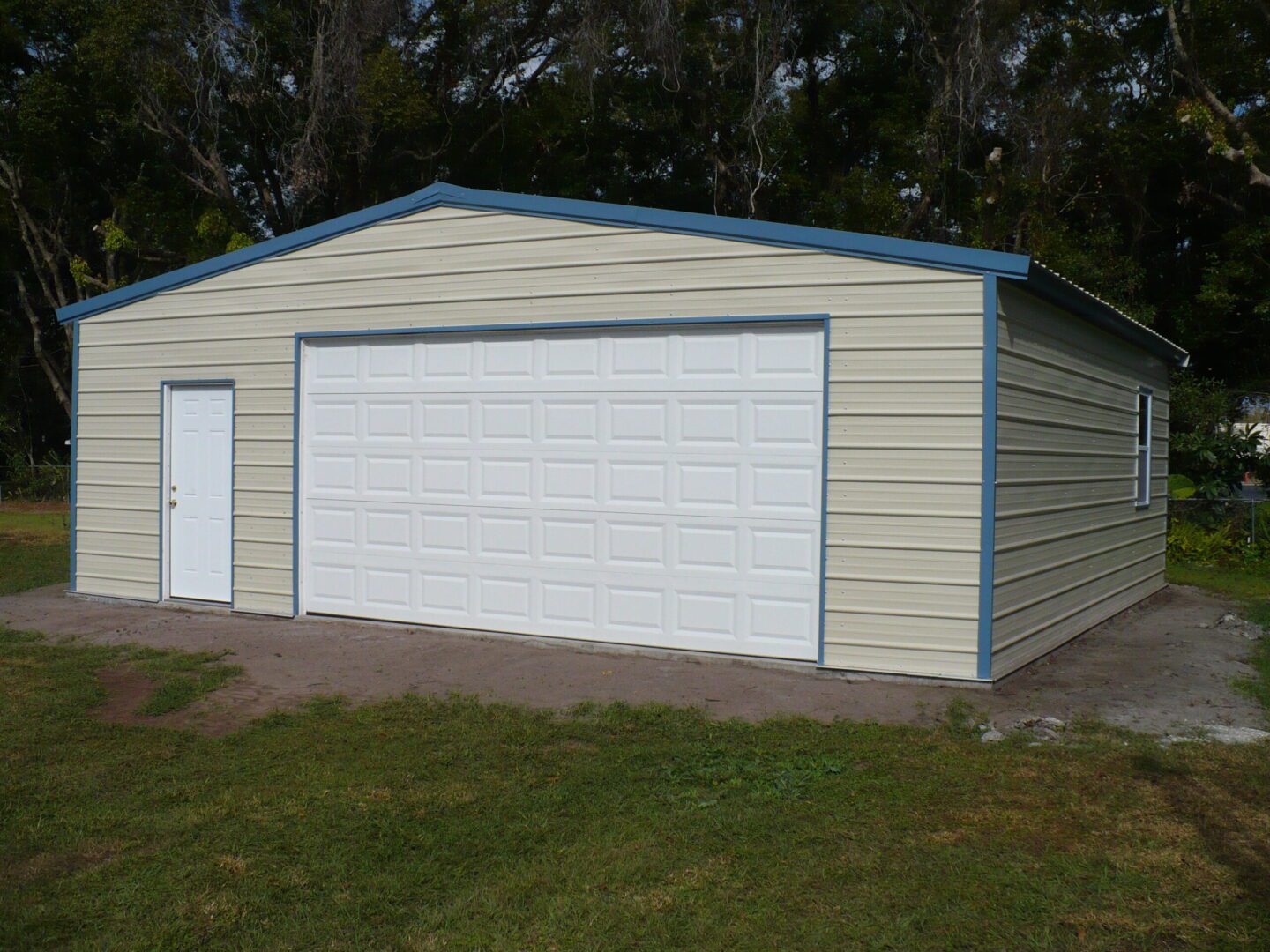 A large garage with two doors and a blue trim.